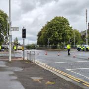 Man rushed to hospital after car crashes through railing in Glasgow