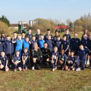 Angela Bitters, her husband Gary Soave, and players from Knightswood FC