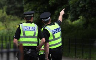 Cops spotted searching area of Glasgow estate 'with torches'