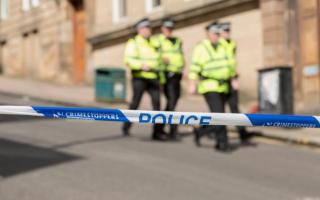 Glasgow road closed after man found injured
