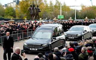 The funeral procession for Sir Bobby Charlton passes Old Trafford, Manchester.