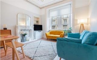 The flat includes a bright spacious lounge with original features