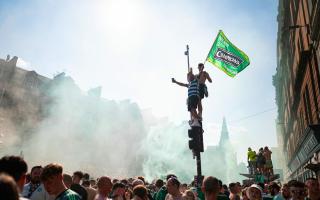 Celtic fans celebrate the Parkhead club's victory in the cinch Premiership in Glasgow city centre last month