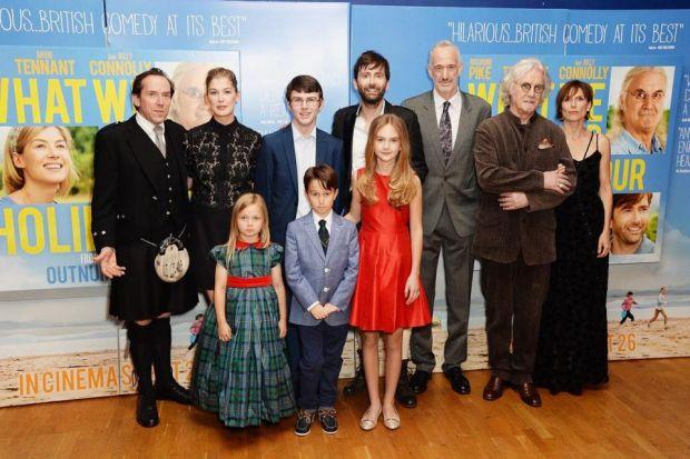 Lewis, standing to the left of David Tennant, with the stars of the movie at its London premiere this week