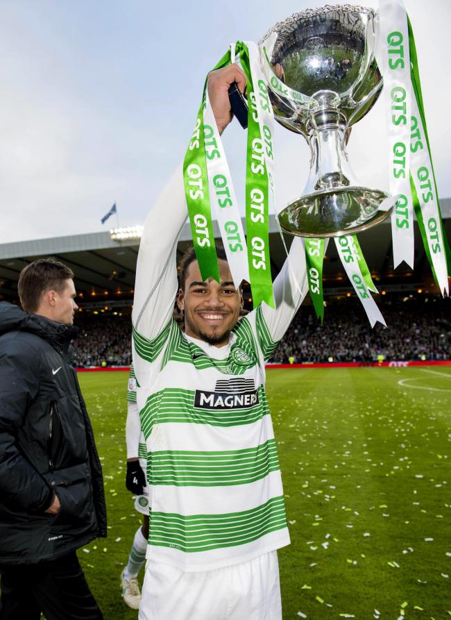 Jason Denayer proudly shows off the QTS League Cup trophy after the 2-0 victory over Dundee United