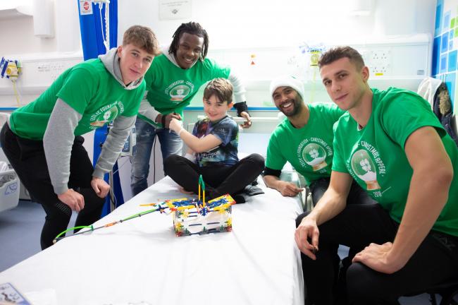 Celtic Team Players lead by captain Scott Brown with Glasgow Children Hospital patient Ashton Young, 11, from Troon on Ceticâ��s visit to children at the hospital 10/12/18 to present Glasgow Childrenâ��s Hospital Charity a cheque for Â&p