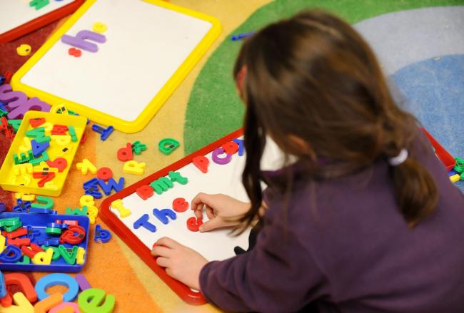 File photo dated 08/02/12 of a primary school child at work in a classroom. Poorer children are already behind in their studies by the time they start school, research in Northern Ireland showed. PRESS ASSOCIATION Photo. Issue date: Friday December 1,