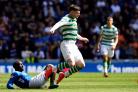GLASGOW, SCOTLAND - MAY 12: Oliver Burke of Celtic is challenged by Glen Kamara of Rangers during the Ladbrokes Scottish Premiership match between Rangers and Celtic at Ibrox Stadium on May 12, 2019 in Glasgow, Scotland. (Photo by Mark Runnacles/Getty Ima
